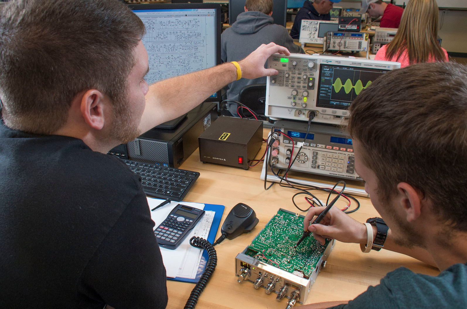 students with computer board